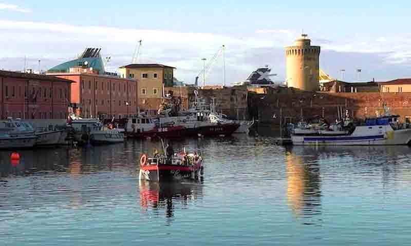 Photo of sightseeing boat cruising the canals near the Porto Mediceo in Livorno port
